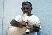 Greek bagpipe player Nikitas Tsimouris playing the tsabouna - Tarpon Springs, Florida