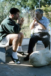 Tsabouna player Nikitas Tsimouris and his apprentice and grand-nephew Nikitas Kavouklis playing practice chanters. The tsabouna is in the foreground - Tarpon Springs, Florida