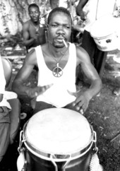 Drummer for Haitian Rara band Konbo Guinyn performs with group - Miami, Florida.