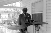 William "Washboard Bill" Cooke poses with his washboard and cymbals