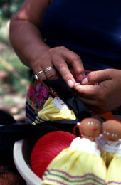 Mary Billie sewing hair on the Seminole doll she is making - Big Cypress Reservation, Florida