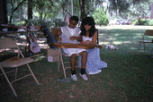 Eugenia Fitchen teaching a girl old-time dulcimer music at the Children's Activity Area- White Springs, Florida