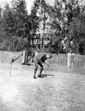 Dr. Tennent Ronalds putting on golf course - Leon County, Florida