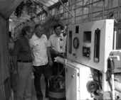 Men viewing a Reverse Osmosis System water machine at the Marie Selby Botanical Gardens in Sarasota, Florida.