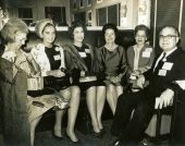 First Lady Lady Bird Johnson with others aboard the campaign train.