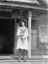 Dollie Booth on the porch of Booth's store