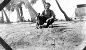 Construction worker with dog and puppies - Long Key, Florida.