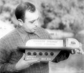 Man holding model of one of the submarine boats - Rainbow Springs, Florida