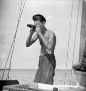 WPA Federal Writers Project photographer Robert Harrison Cook on a boat