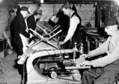 WPA defense workers repairing shoes for the U.S. Army