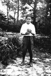 Rokuo Kamiya holding a box camera- Yamato, Florida