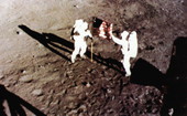 Astronaut Neil Armstrong and Buzz Aldrin erecting U.S. flag on the moon