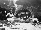 Nancy Tribble posed with underwater sign at Weekiwachee Spring.