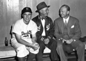 Red Barber sitting with friends before a baseball game.