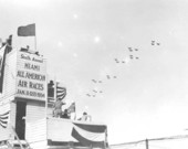 Army planes over timing stand at all American air meet