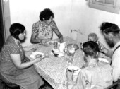 Family of migrant workers having supper