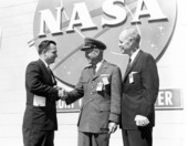 Commissioner of Agriculture Doyle Conner meeting Major General Leighton I. Davis as Governor Bryant looks on.