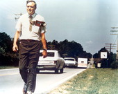 Florida State Senator Lawton Mainor Chiles Jr. walking on side of road during campaign for U.S. Senate