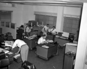 Interior view showing employees in the newsroom at the Tallahassee Democrat.