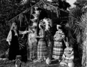 Young women drink at the Fountain of Youth at the Distant Drums premiere - Saint Augustine, Florida