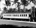 A young girl stands on the passenger car "Rambler" displayed at the Flagler Museum - Palm Beach, Florida.