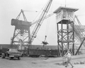 A crane loading scrap metal onto a rail car - Panama City, Florida