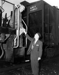 Acting Governor Charley E. Johns shaking the hand of train engineer - Starke, Florida